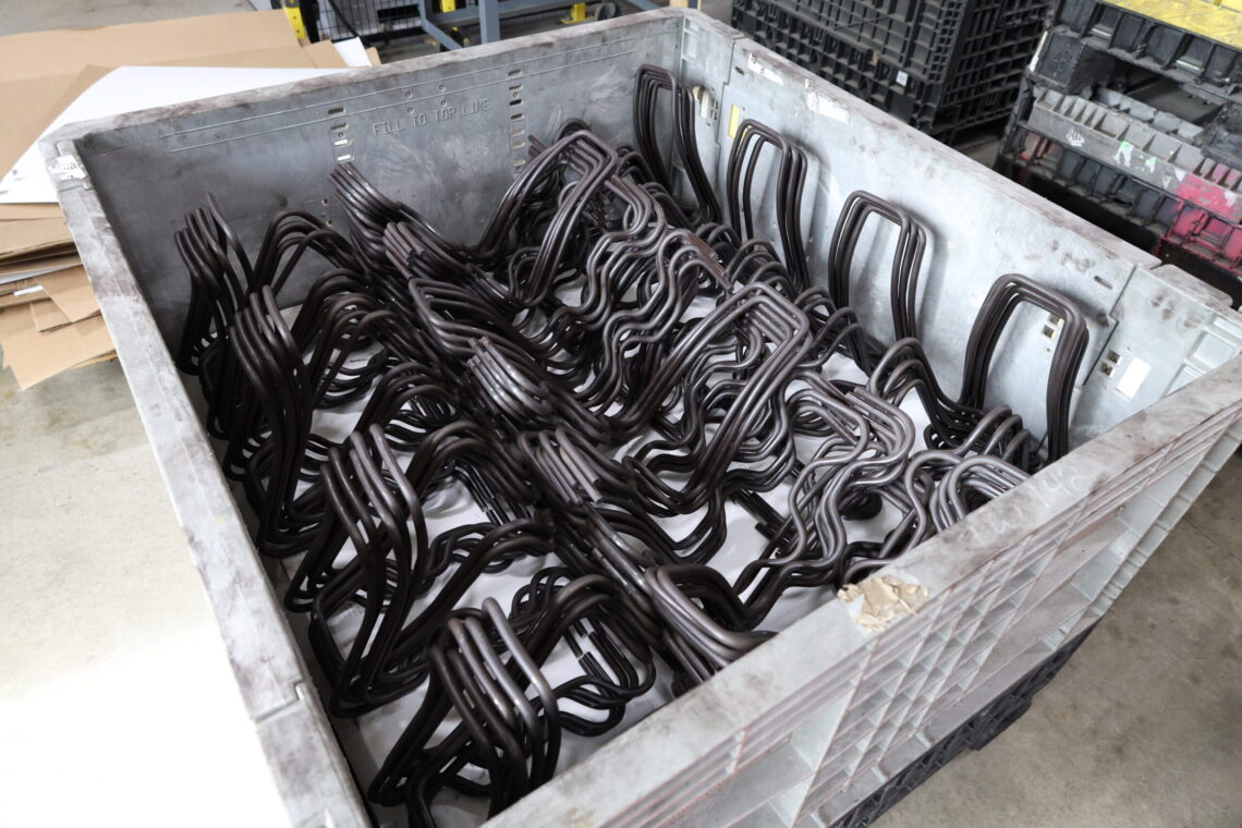 Bin of large wire forms manufactured at Apex.