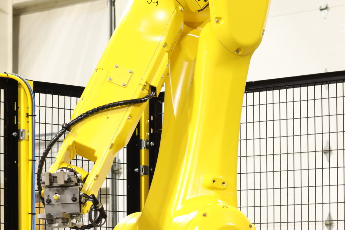 Full side view of Bender the Fanuc Robot at Apex in the wire bending department.