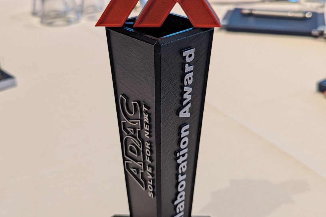 Image of the 2024 ADAC Collaboration Award sitting on a table after being giving to the Apex team.